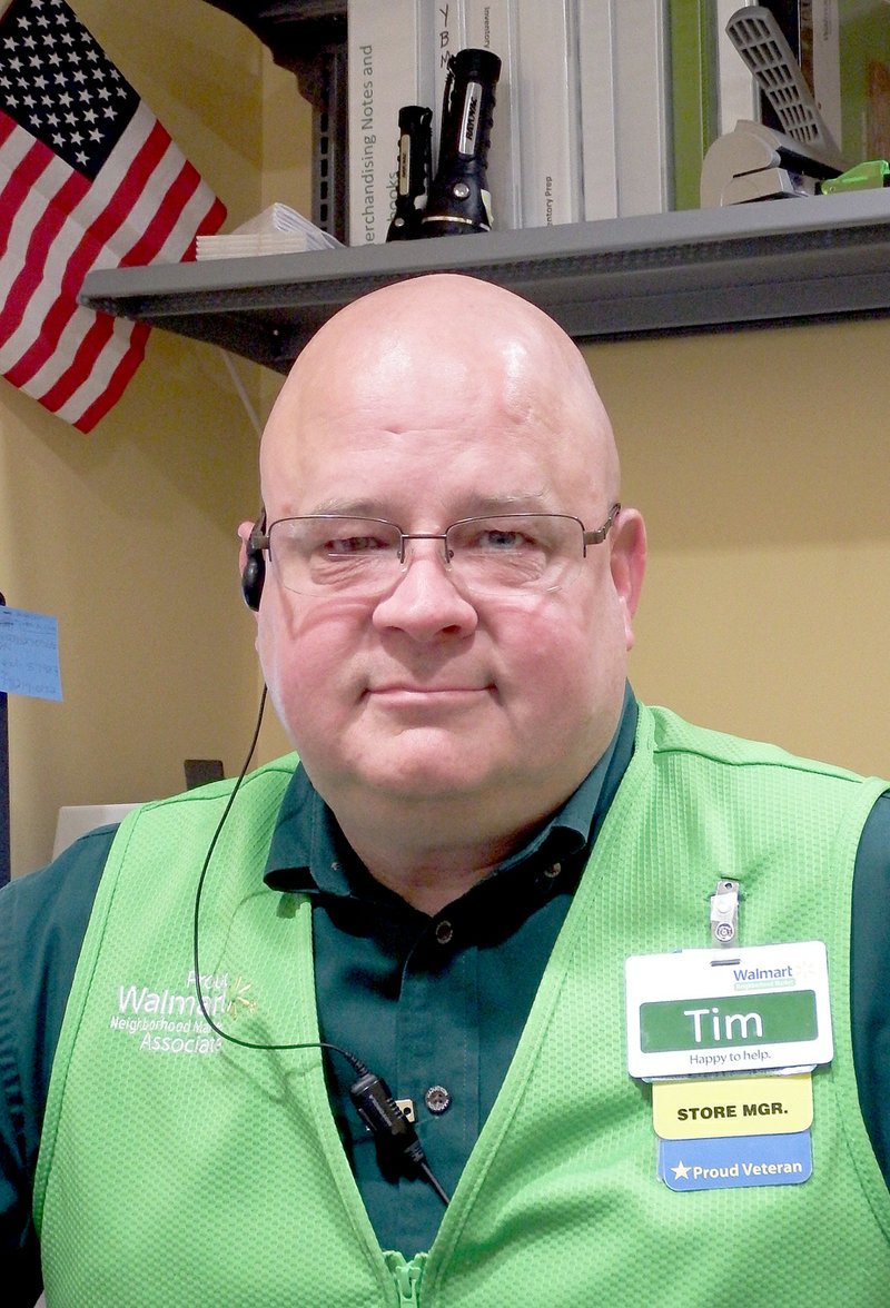 TIMES photograph by Annette Beard Tim Costello, manager of Walmart Neighborhood Market, is a U.S. Navy veteran.