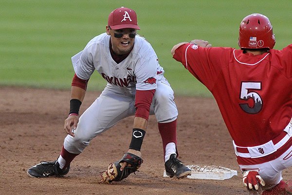 Arkansas second baseman Rick Nomura tags St. John's base runner Robbie Knightes during a game Sunday, May 31, 2015, at Allie P. Reynolds Stadium in Stillwater, Okla. 