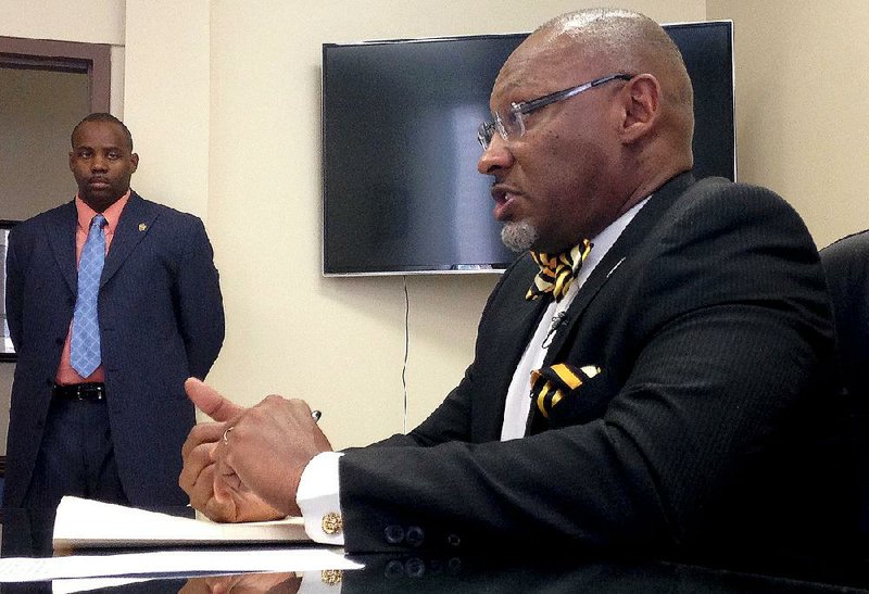 Dougherty County District Attorney Gregory Edwards said at a news conference Wednesday in Albany, Ga., that Kenlissia Jones still faces a drug charge. At right is Albany Police Chief Michael Persley. 