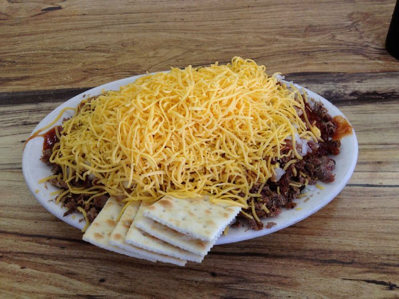 Joe’s Tamale Spread, a tamale covered with Fritos, beans, chopped beef, cheese and onions, is a signature dish at McClard’s Bar-B-Q in Hot Springs. 