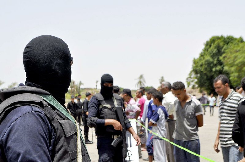 Security forces stand guard after a suicide attack was thwarted Wednesday at the temple of Karnak in Luxor, Egypt. 