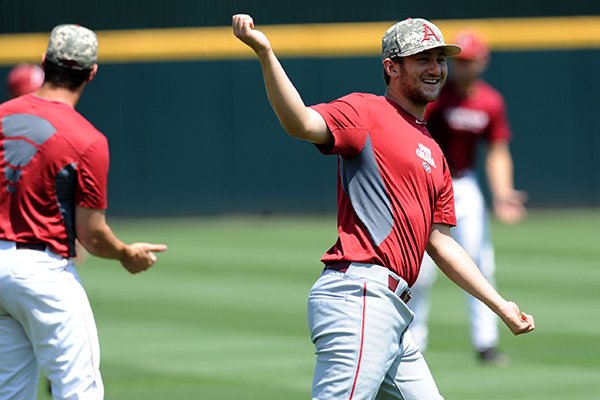 Arkansas left fielder Joe Serrano laughs Thursday, June 4, 2015, during practice at Baum Stadium in Fayetteville.