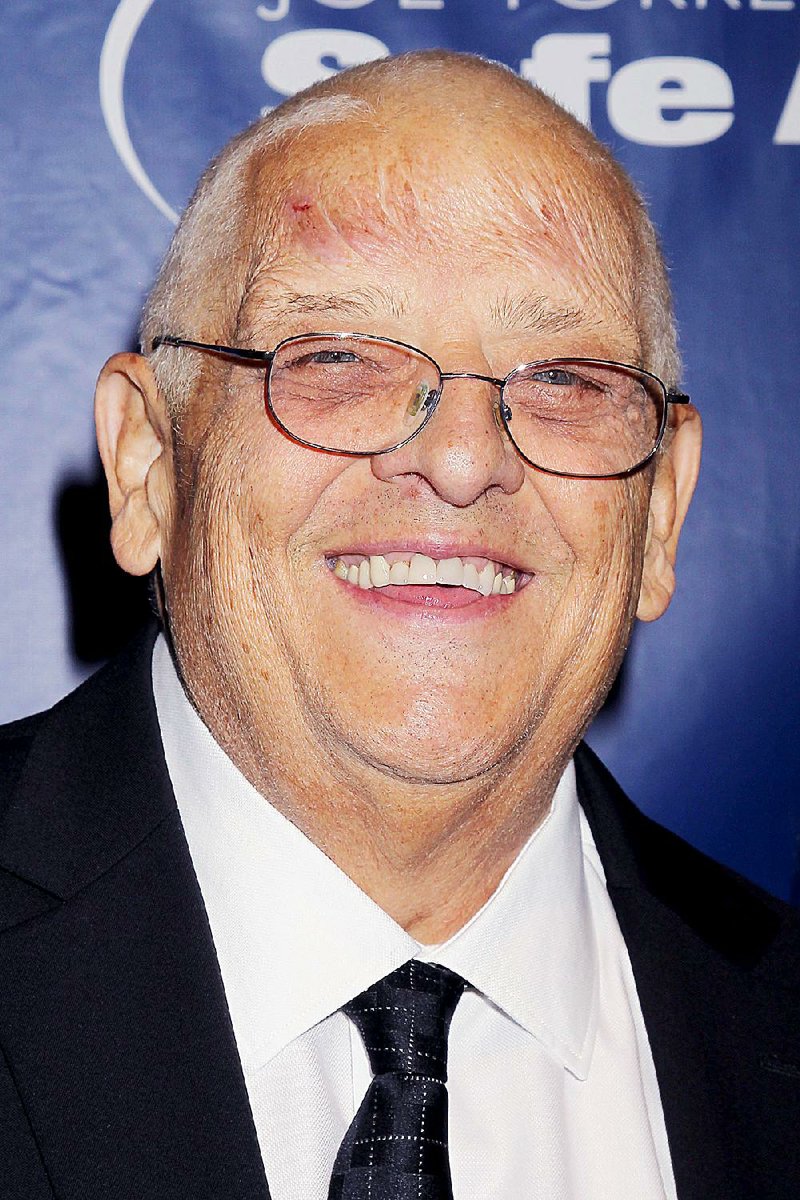 In this Nov. 13, 2014 photo released by Starpix, WWE wrestler Dusty Rhodes, whose real name is Virgil Runnels, poses at the Joe Torre Safe at Home Foundations 12th Annual Gala in New York. The WWE said Runnels died Thursday, June 11, 2015.