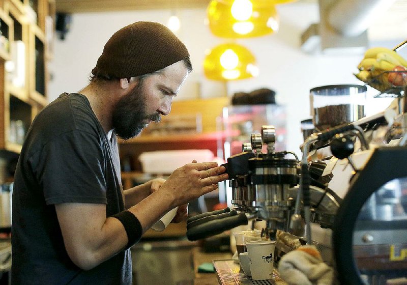 J.P. Aristizabal prepares coffee last week at Panther Coffee, an independent coffee shop and wholesaler in Miami. Spending growth at restaurants rose just 0.1 percent in May, the Commerce Department said Thursday. But restaurant and bar receipts have surged 8.2 percent over the past year. 