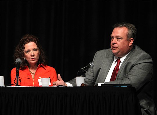 The Sentinel-Record/Richard Rasmussen LEGISLATIVE UPDATE: State Rep. John Vines, right, D-District 25, discusses the 90th General Assembly with fellow legislators Thursday in Horner Hall of the Hot Springs Convention Center for the Arkansas Bar Association's 117th Annual Meeting. State Rep. Mary Broadway, left, D-District 57, joined Vines and two state senators to examine this year's session.