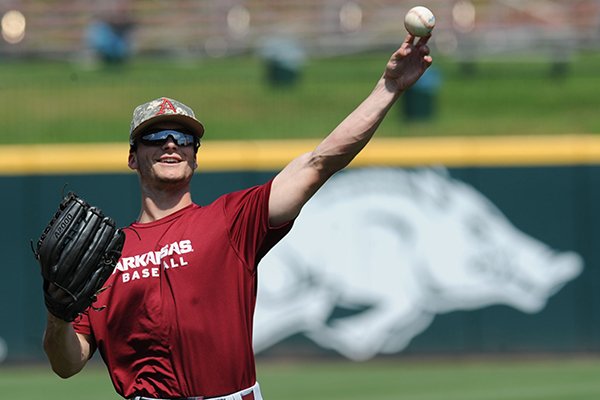 Arkansas center fielder Andrew Benintendi warms up Thursday, June 4, 2015, during practice at Baum Stadium in Fayetteville.