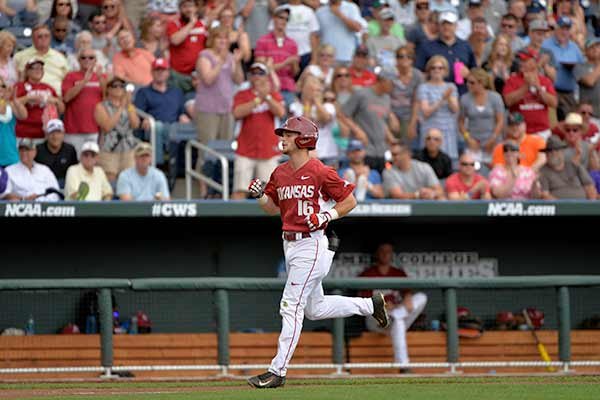 Arkansas' Andrew Benintendi is cheered by fans after he hit a solo home run against Arkansas in the fifth inning of an NCAA College World Series baseball game at TD Ameritrade Park in Omaha, Neb., Saturday, June 13, 2015. (AP Photo/Ted Kirk)