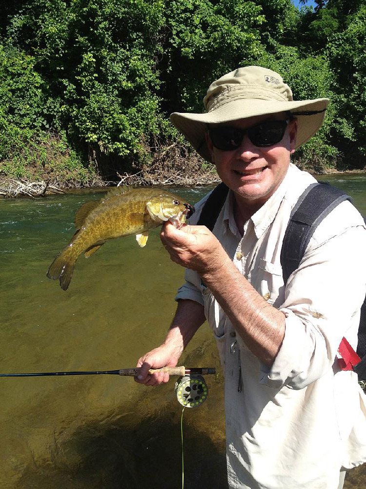 Rusty Pruitt of Bryant caught his first smallmouth Tuesday with a fly rod and a lead-eye leech on Crooked Creek. 