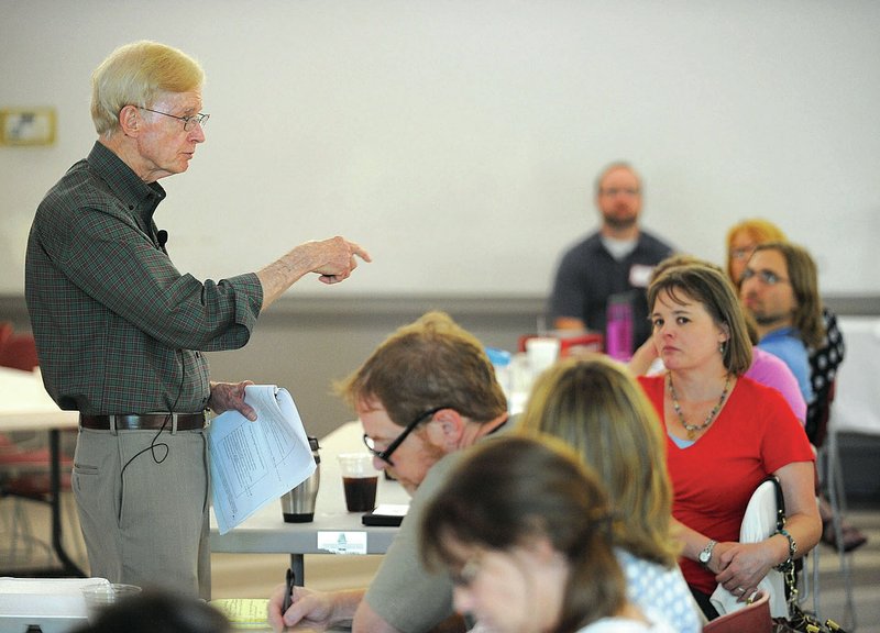 Garry Landreth, founder of the Center for Play Therapy at the University of North Texas, speaks Friday while leading a workshop for counselors and students for play therapy at St. Paul’s Episcopal Church facilitated by a new office for play therapy at the University of Arkansas.