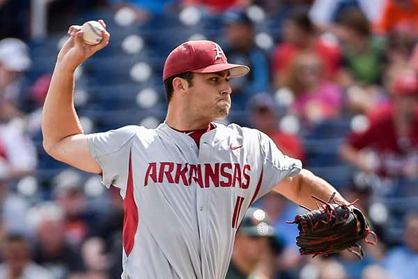 Arkansas starting pitcher Keaton McKinney delivers against Miami in the first inning of an NCAA College World Series baseball tournament elimination game at TD Ameritrade Park in Omaha, Neb., Monday, June 15, 2015. (AP Photo/Mike Theiler)