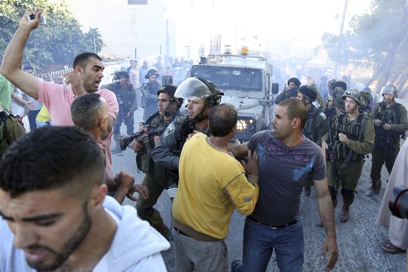 Palestinian scuffle with Israeli soldiers Sunday after a Palestinian was killed in clashes with Israeli forces in the village of Kafr Malik near the West Bank city of Ramallah. Abdallah Ghanayem, 22, was struck and killed by an Israeli army jeep.