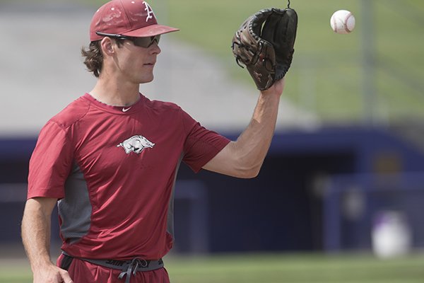 Arkansas pitcher Jackson Lowery warms up during practice Sunday, June 14, 2015, at Bellevue East High School in Bellevue, Neb. 