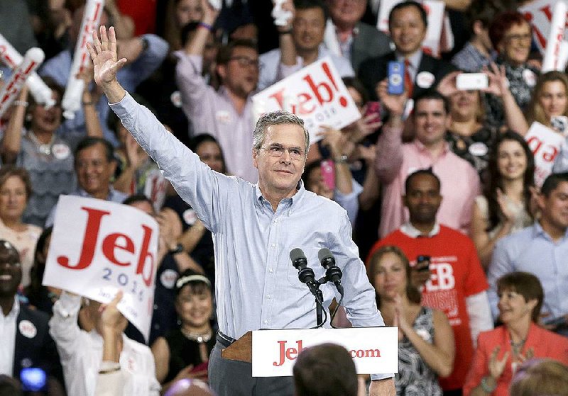 Former Florida Gov. Jeb Bush waves as he arrives to announce his bid for the Republican presidential nomination, Monday, June 15, 2015, at Miami Dade College in Miami.