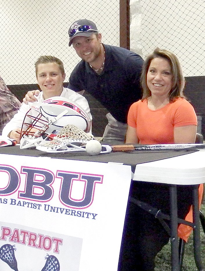 TIMES photograph by Annette Beard Blackhawk Austin Hicks was joined by his parents Shawn and Cindy Hicks at a ceremony celebrating his signing to play lacrosse for Dallas Baptist University.