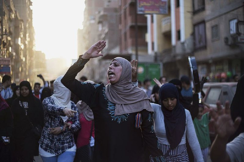 Supporters of the Muslim Brotherhood protest against the Egyptian court ruling of the death sentence for ousted Islamist President Mohammed Morsi on Tuesday in Cairo. 