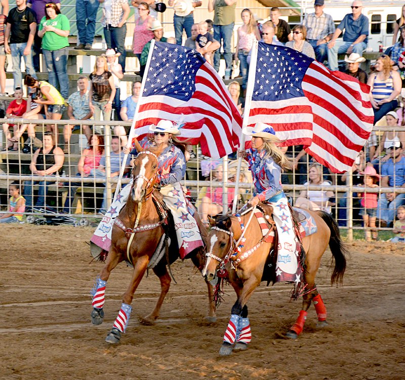 Janelle Jessen/file photo Riders of the Sky High Angels carry the stars and stripes of the American flag during last year&#8217;s rodeo.