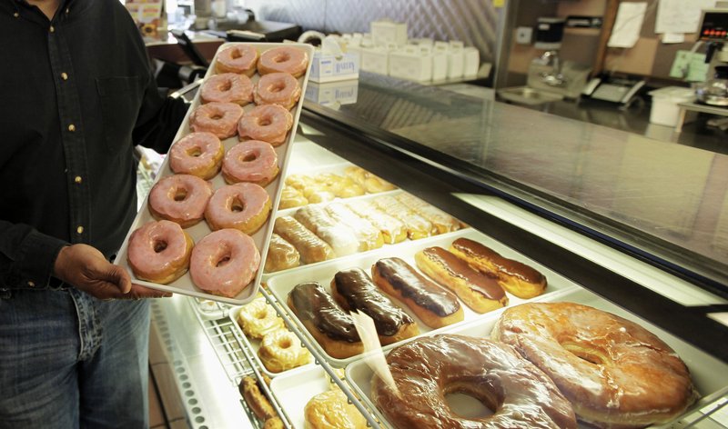 In this April 26, 2011 file photo, doughnuts are displayed in Chicago. The Obama administration is cracking down on artificial trans fats, calling them a threat to public health.