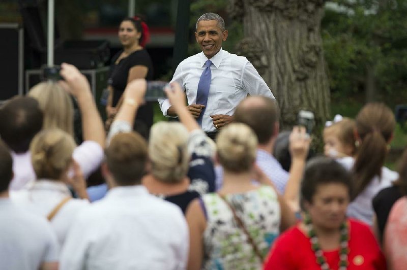 President Barack Obama arrives for a picnic for Congress at the White House on Wednesday, June 17, 2015. A Supreme Court ruling against health care subsidies would mean “utter chaos,” his press secretary, Josh Earnest, said Wednesday.