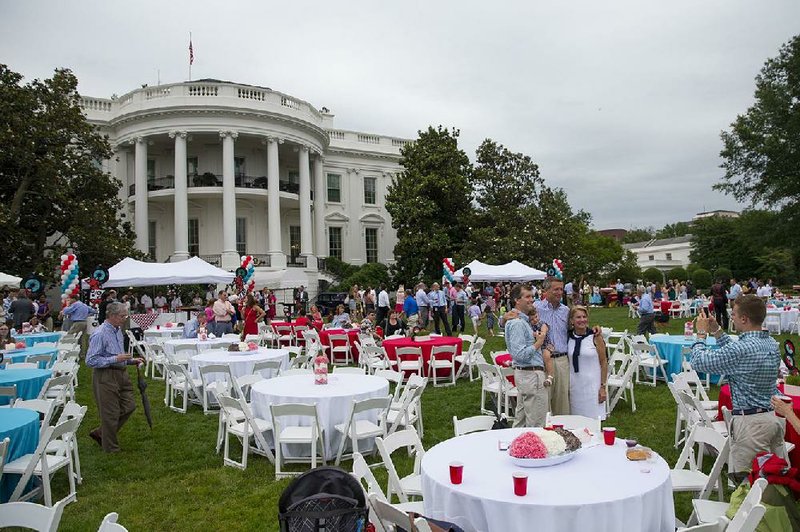 Guests gather Wednesday at the White House for a picnic for members of Congress. Earlier in the day, Republicans in the House and Senate discussed temporary aid for millions of people who stand to lose federal health care subsidies if the Supreme Court overturns subsidies.