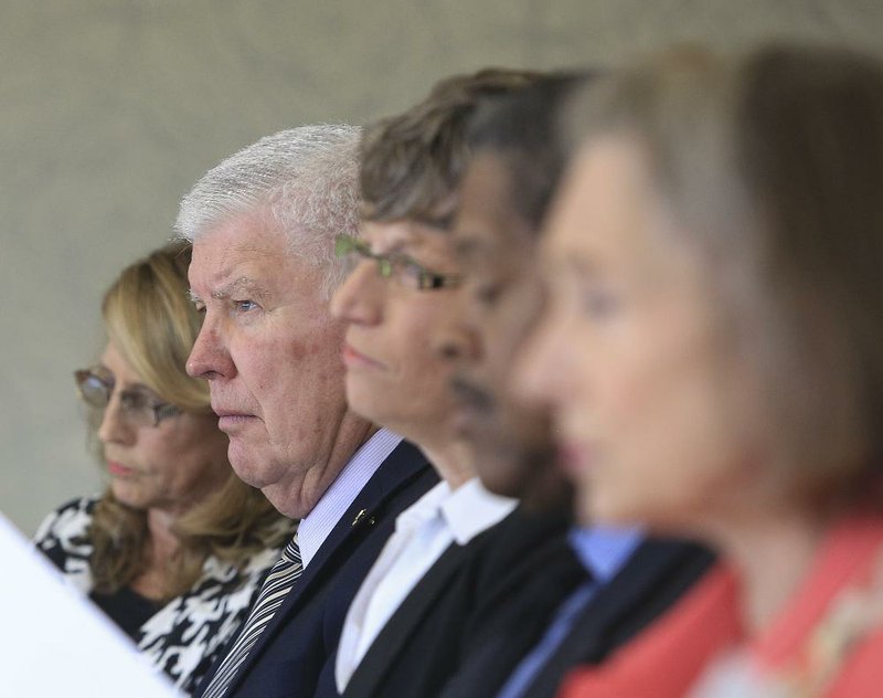 Pulaski Technical College board of trustees members (from left) Diane Bray, James Herzfeld, Pulaski Tech President Margaret Ellibee, board chairman Ronald Dedman and trustee MaryJane Rebick listen to a presentation Wednesday morning during a meeting at the school’s south campus. 