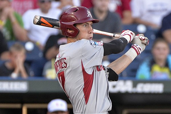 Arkansas' Bobby Wernes (7) follows through on his RBI single ball that scored Clark Eagan (9) in the seventh inning of an NCAA College World Series baseball elimination game against Miami at TD Ameritrade Park in Omaha, Neb., Monday, June 15, 2015. (AP Photo/Ted Kirk)