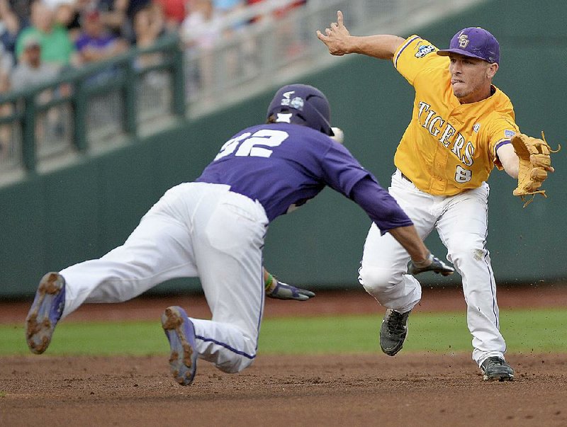 LSU Tigers shortstop Alex Bregman (8) runs to first base during