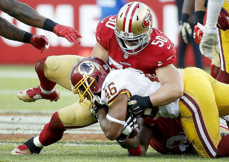 The retirement of former San Francisco 49ers linebacker Chris Borland (50) and other factors have some people associated with the NFL thinking the game can be played without helmets. 