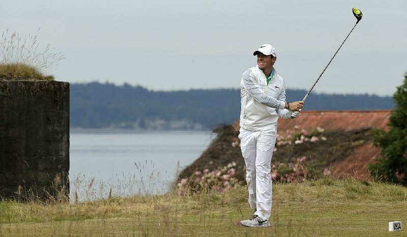 Golfer Rory McIlroy watches his tee shot on the 18th hole during the first round of the U.S. Open golf tournament at Chambers Bay Golf Club on Thursday in University Place, Wash. McIlroy, who leads the World Golf Rankings, finished the first round 2 over par.