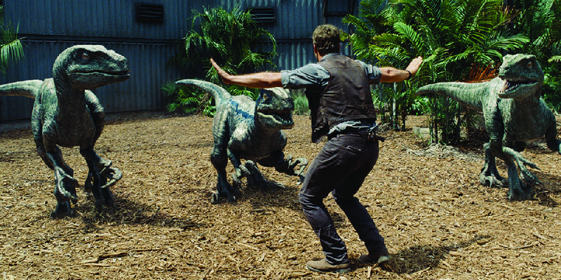 Owen (Chris Pratt) attempts keep the raptors at bay in Jurassic World. It broke all box-office records last weekend and made about $209 million.
