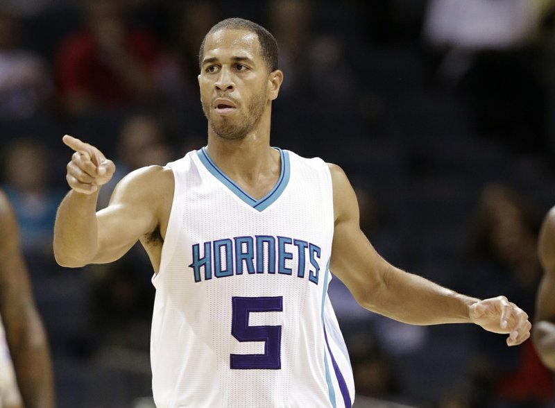 Charlotte Hornets' Jannero Pargo (5) reacts after making a three point basket against the Orlando Magic during the second half of a preseason NBA basketball game in Charlotte, N.C., Monday, Oct. 13, 2014. The Hornets won 99-97. (AP Photo/Chuck Burton)