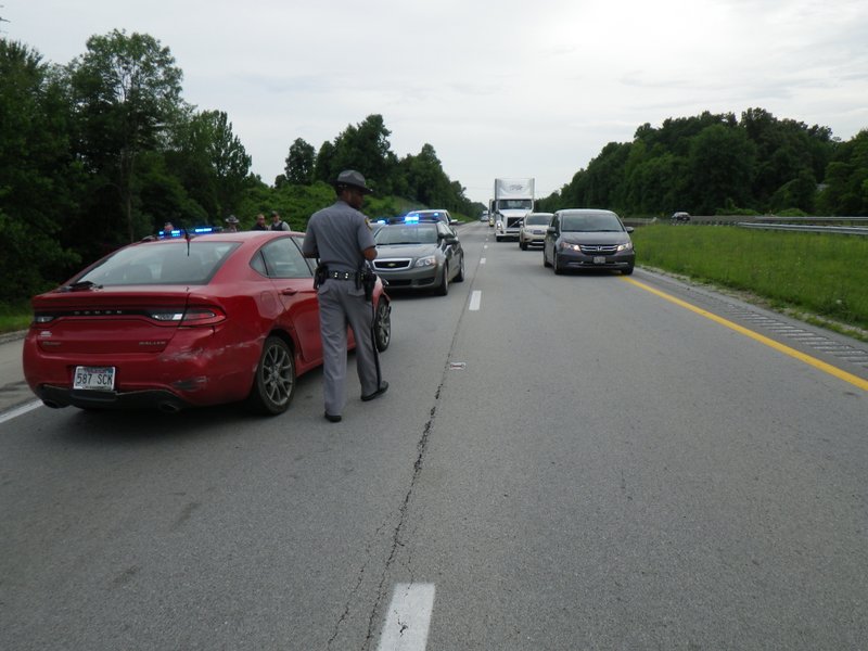 Trent Tyrone Smith's red Dodge Dart was immobilized by a police officer in Munfordville, Ky., on Thursday, June 18, after a 20-mile chase down Interstate 65. Smith was wanted in a Thursday morning domestic disturbance in Bauxite, the Saline County sheriff's office said. 