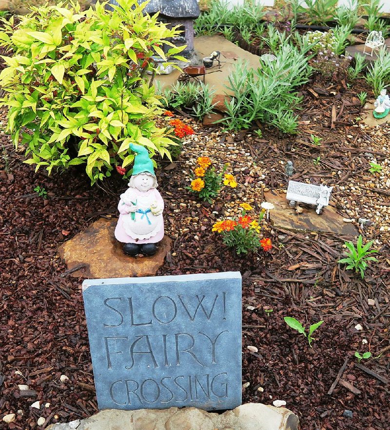 An appropriately small garden gnome greets visitors to a fairy village in the Children’s Garden at the Learning Fields, a River Valley (Sebastian and Crawford counties) Master Gardeners project at Chaffee Crossing. 