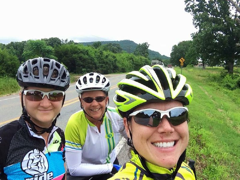 This selfie of Hannah Turnbough and Leslie Oslica, both of Conway, with Julie Hathcock of Malvern was taken 60 miles into a 100-mile training ride from Conway to Petit Jean Mountain to Dardanelle. The peak in the background is nearly 2,500 feet and it’s reached in a relatively short two-mile (roughly) span and “makes for some good climbing practice for the Race Across America,” which the three are undertaking (with a fourth teammate) right now.
