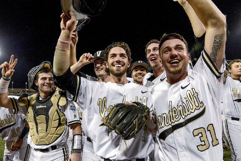 Vanderbilt players celebrate after Friday night’s 7-1 victory over TCU at the College World Series in Omaha, Neb. The Commodores advanced to the best-of-3 championship series for the second year in a row and will attempt to win their second consecutive national title against Florida or Virginia. 