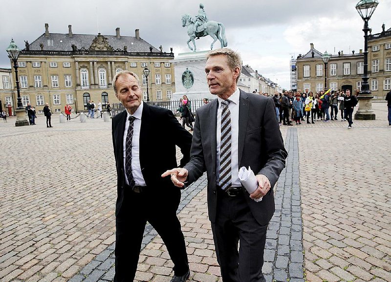 Head of the Danish People’s Party Kristian Thulesen Dahl (right) and party colleague Peter Skaarup arrive Friday at Christian IX’s Palace at Amalienborg Castle in Copenhagen to inform Danish Queen Margrethe about who the party wants to lead the forthcoming negotiation to form a new Danish Government. 