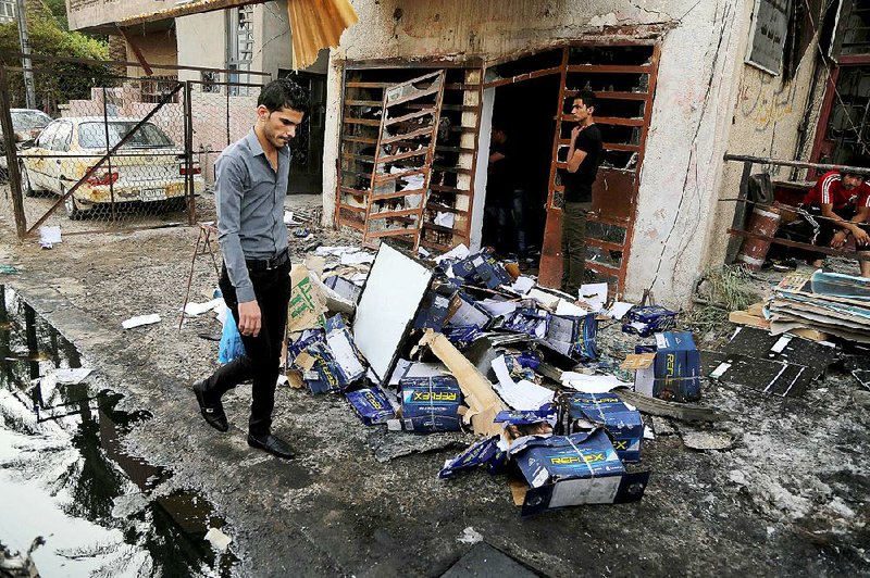 Civilians inspect the site of a car-bomb attack last week in Baghdad. Extremists in Iraq, Afghanistan and Nigeria unleashed a savage rise in violence between 2013 and 2014, according to new statistics released by the State Department. 