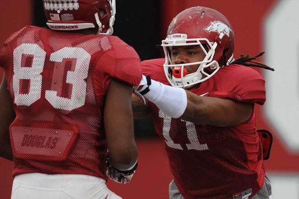 Will Gragg of Arkansas works through a drill during practice Saturday, April 18, 2015, at the university's practice facility in Fayetteville.