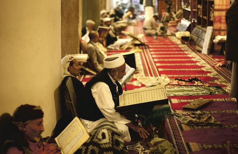 Muslims read verses of the Quran, Islam’s holy book, on the first day of the 2013 fasting month of Ramadan in the grand Mosque in the old city of Sanaa, Yemen. Muslims around the world observe Ramadan with a dawn-to-dusk fast. The most holiest of months began Thursday in Northwest Arkansas.