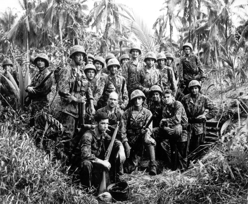 This January, 1944, file photo shows U.S. Marine Raiders posing in front of a Japanese stronghold they conquered at Cape Totkina, Bougainville in the Solomon Islands. From now on, an elite branch of the U.S. Marine Corps will officially be known as Raiders, similar to names like Army Green Berets and Navy SEALs.  