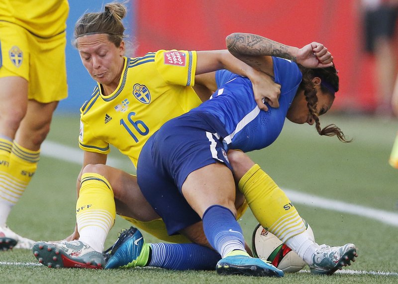  In this June 12, 2015, file photo, Sweden's Lina Nilsson (16) hauls down United States' Sydney Leroux (2) during second-half FIFA Women's World Cup soccer game action in Winnipeg, Manitoba, Canada. Sweden drew Group D, the so-called Group of Death, with the United States, Australia and Nigeria. 