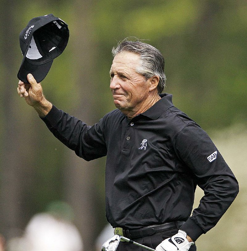 Former Masters champion Gary Player of South Africa waves to the gallery on the 13th hole during the second round of the Masters golf tournament at Augusta National Golf Club in Augusta, Ga., in this April 2009 file photo. Player did not hold back in his criticism of Chambers Bay Golf Course, host of this year’s U.S. Open.