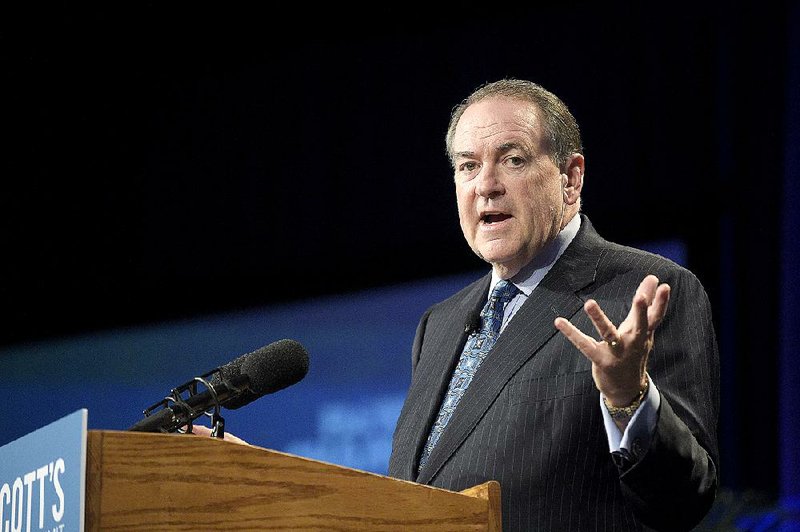 Republican presidential candidate, former Arkansas Gov. Mike Huckabee addresses attendees during Rick Scott's Economic Growth Summit in Lake Buena Vista, Fla., Tuesday, June 2, 2015. 