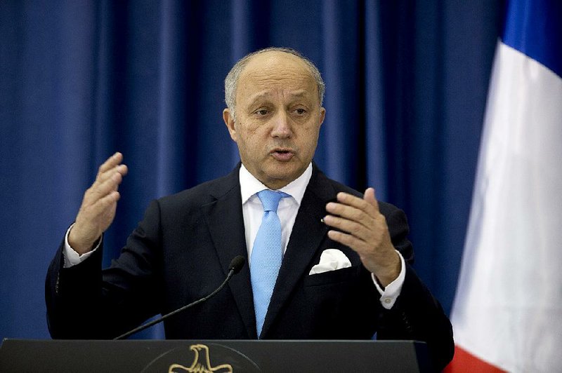 French Foreign Minister Laurent Fabius addresses a news conference Sunday in the West Bank city of Ramallah.