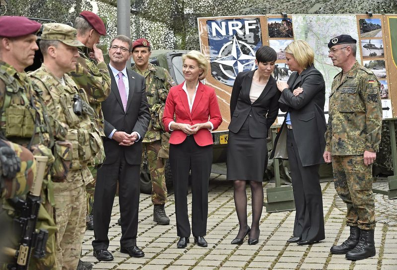 U.S. Secretary of Defense Ash Carter and the minsters of defense Ursula von der Leyen (Germany), Ine Eriksen Soreide (Norway) and Jeanine Hennis-Plasschaert (Netherlands), from left, talk to Nato Response Force soldiers during their visit to the I. German-Dutch Brigade in Muenster, Germany, Monday, June 22, 2015. The troops are part of NATO's Very High Readiness Joint Task Force (VJTF). 