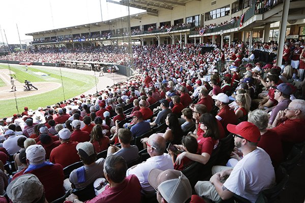 Fans watch game action during the second inning in a super regional of the NCAA college baseball tournament between Arkansas and Missouri State in Fayetteville, Ark., Sunday, June 7, 2015. (AP Photo/Danny Johnston)