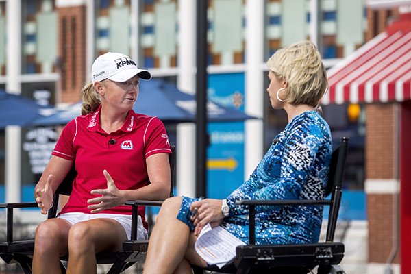 LPGA player Stacy Lewis (left) is interviewed for a live segment for The Golf Channel's show, "The Morning Drive, " by host Lisa Cornwell, both former Razorback golfers, on Tuesday, May 19, 2015, in downtown Bentonville.