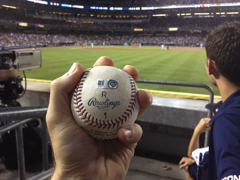 Zack Hample holds the ball Alex Rodriguez of the New York Yankees hit for a home run for his 3,000th career hit. Hample said he will give the ball to the Yankees if they meet his demands, which include donating to a charity. 