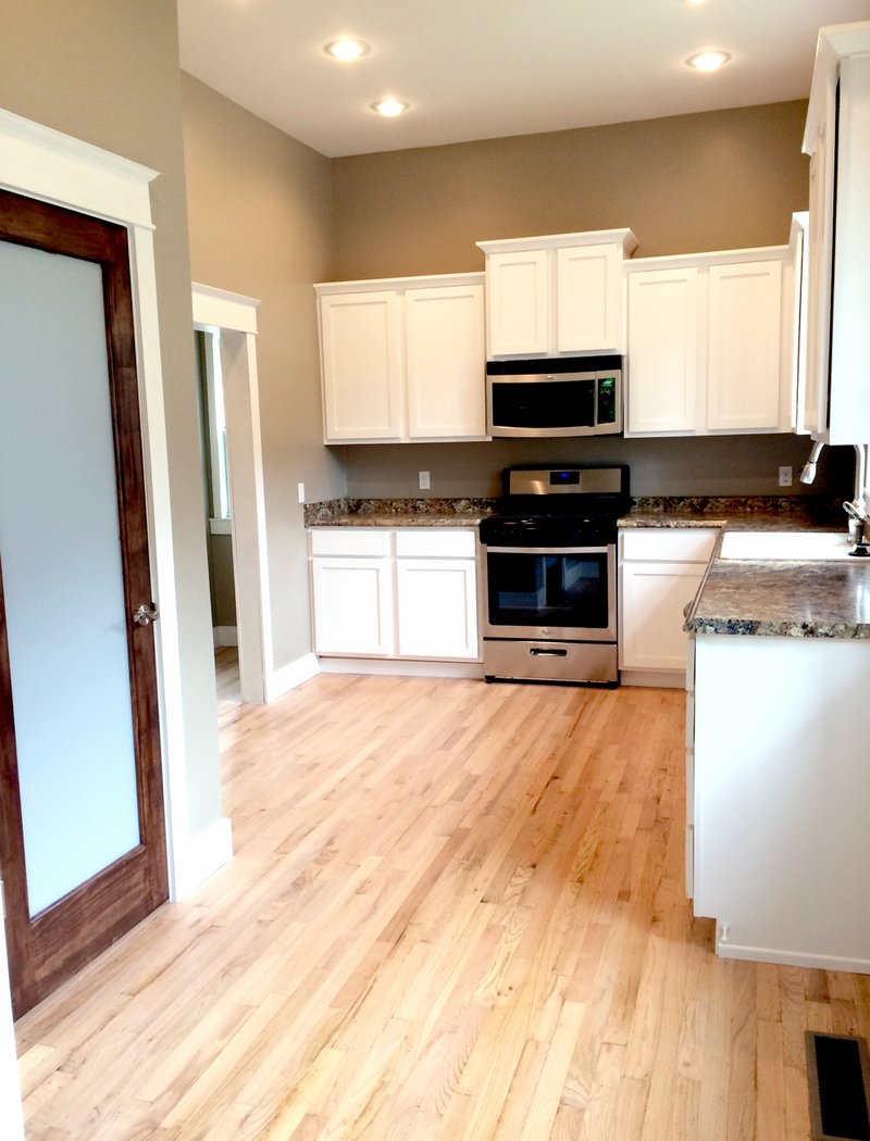 Landon Reeves/Herald-Leader The Bever family added new appliances, paint, and cabinets to the kitchen of their house on Twin Springs Street. Pictured here is the kitchen after the renovation.