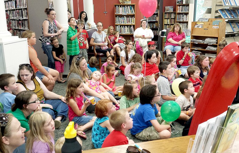 Submitted Youngsters and adults gather recently to celebrate the kickoff of the Bella Vista Public Library&#8217;s annual Summer Reading program .