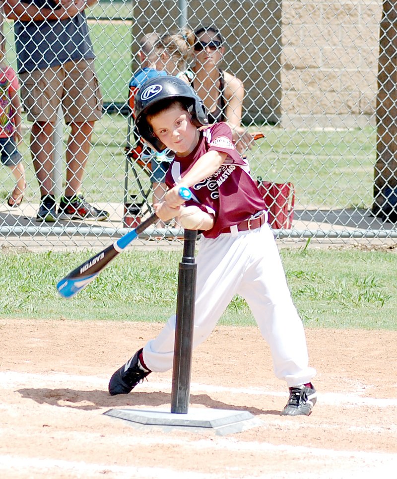 Graham Thomas/Herald-Leader Camden Newell, of the Siloam Springs All-Stars, takes a big swing at the baseball Saturday during the North Arkansas Cal Ripken District 4/5 6-year-old Tournament held at James Butts Baseball Park. Siloam Springs won their district and will now play in the regional tournament in Bryant on July 8.